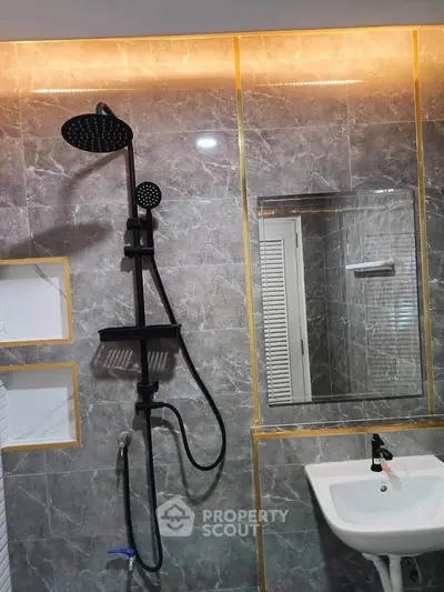 Luxurious bathroom with modern shower and elegant marble tiles