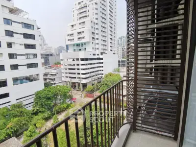 Modern urban balcony with cityscape view, perfect for enjoying the vibrant city life.