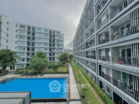 Modern apartment complex with pool and garden view