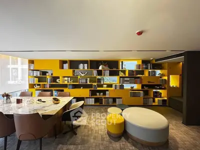Modern study room with stylish yellow shelving and elegant marble table