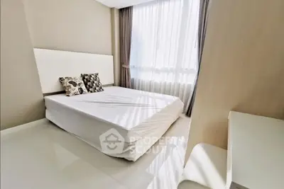 Bright minimalist bedroom with large window and modern decor