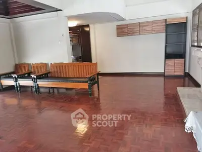 Spacious living room with wooden flooring and modern furniture