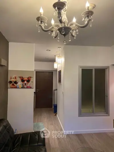 Stylish living room with elegant chandelier and modern decor