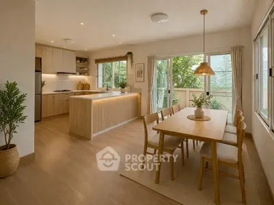 Modern open-layout kitchen and dining area with natural light and stylish decor.