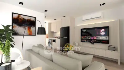 Modern living room with open kitchen, stylish decor, and large TV for entertainment.
