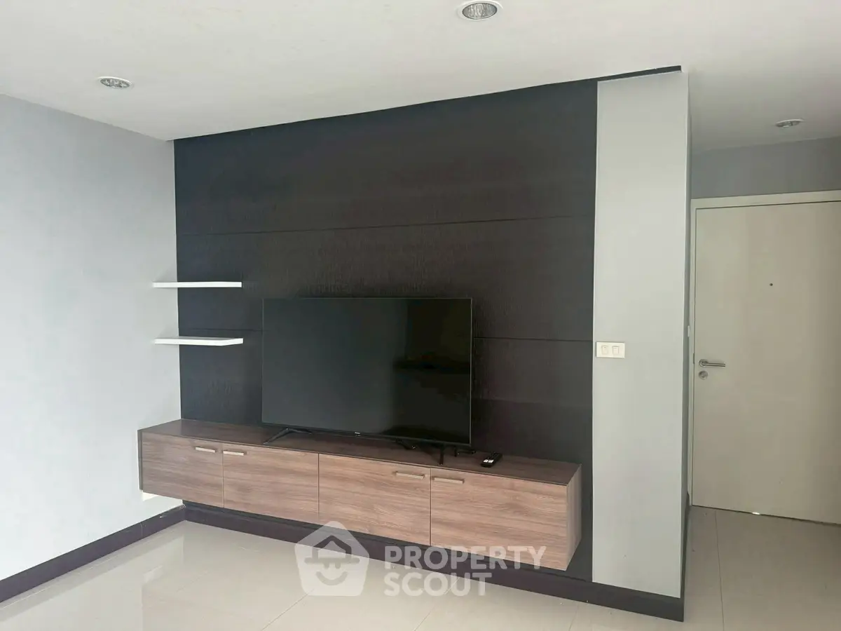 Modern living room with sleek TV unit and minimalist design