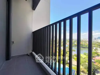 Spacious balcony with stunning city and river views, perfect for relaxation and enjoying the skyline.