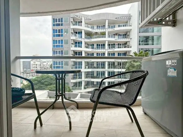 Modern balcony with seating and city view in contemporary apartment