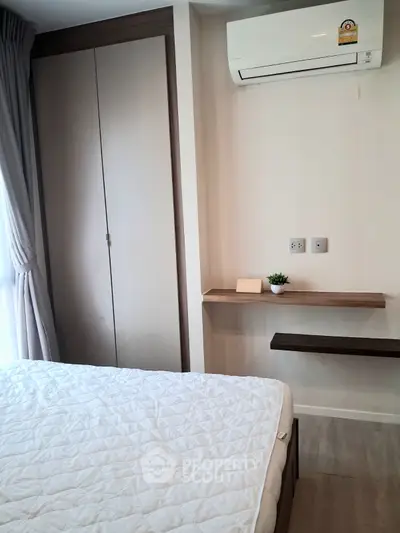 Modern bedroom with air conditioning and natural light