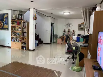 Spacious living room with modern decor and ample natural light