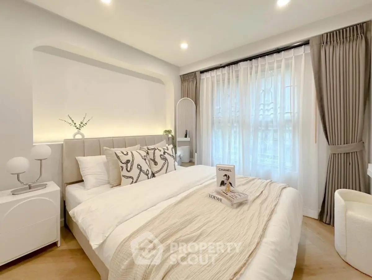 Elegant bedroom with stylish decor and natural light