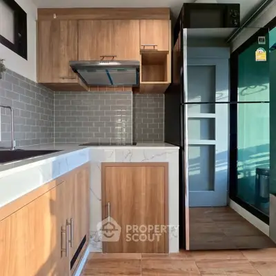Modern kitchen with sleek cabinetry and stainless steel appliances