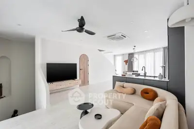 Modern open-concept living room with sleek design and stylish furniture