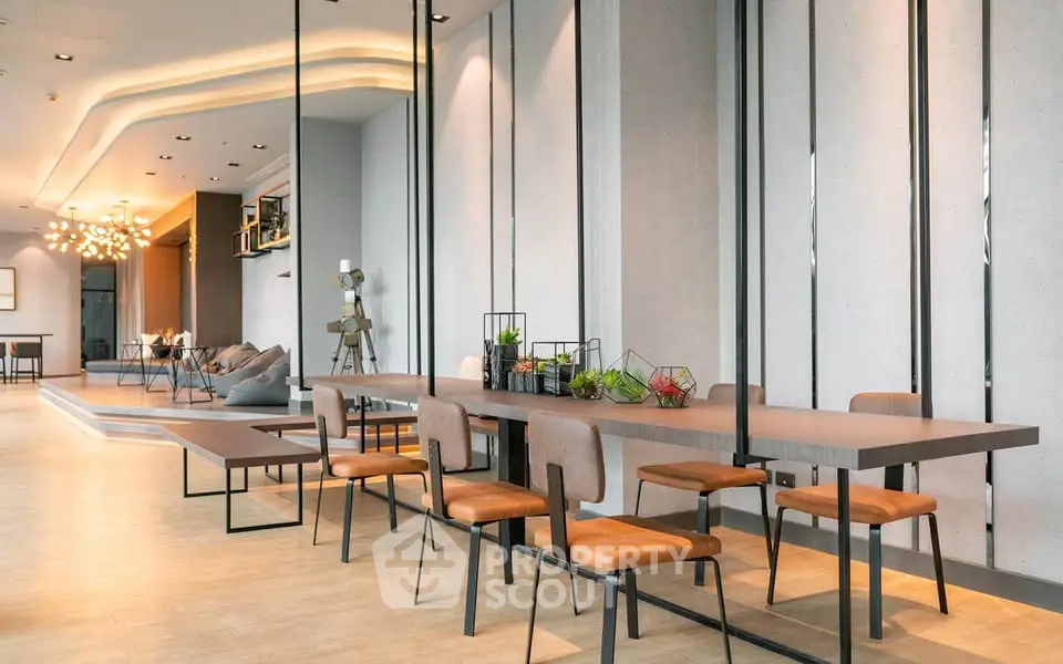 Modern open-plan living area with stylish dining setup and contemporary decor.