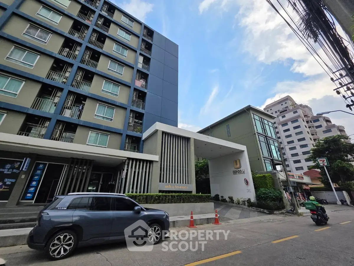 Modern urban apartment building with sleek design and convenient city location.
