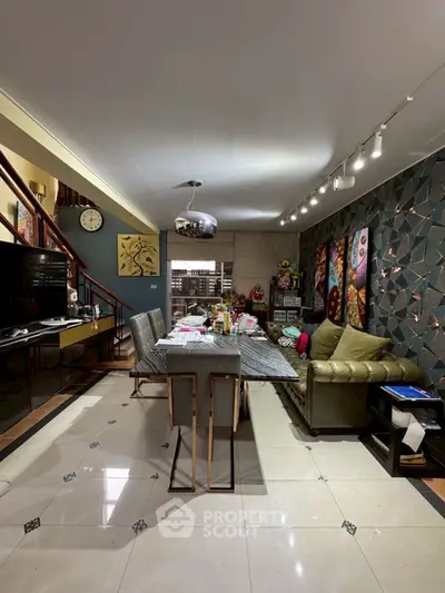 Stylish living room with modern decor and elegant dining area