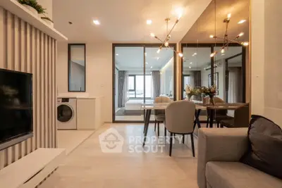 Modern open-plan living and dining area with stylish decor and natural light.