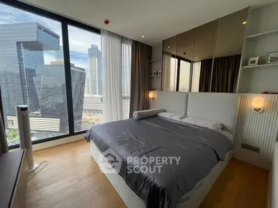 Luxurious bedroom with stunning city view and modern decor
