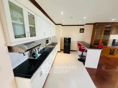 Spacious kitchen with modern appliances and breakfast bar seating