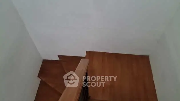 Wooden staircase with minimalist design in modern home