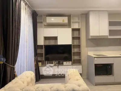 Modern living room with built-in entertainment center and cozy seating area.