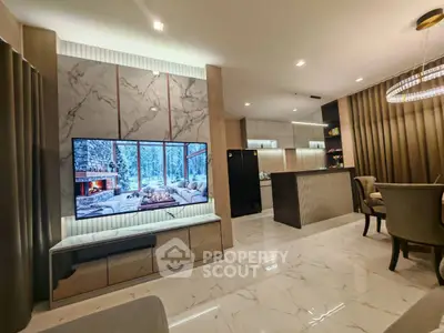 Luxurious modern living room with marble floors and open kitchen layout