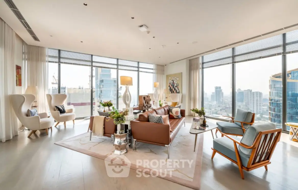 Luxurious living room with panoramic city view, elegant furniture, and abundant natural light.