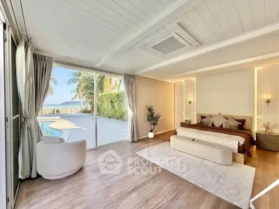 Luxurious bedroom with pool view and elegant decor, featuring large windows and stylish furnishings.