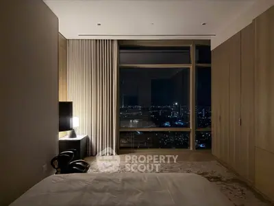 Luxurious bedroom with stunning night city view and elegant decor