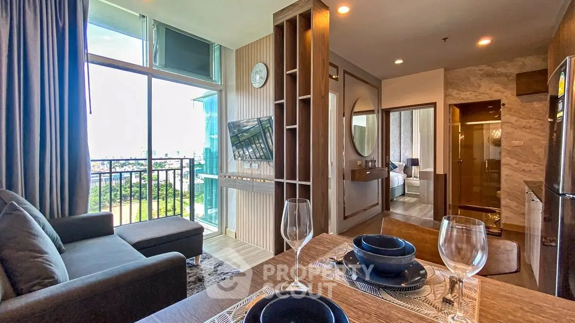 Modern open-plan living room with balcony and stylish decor