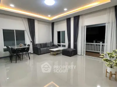 Spacious modern living room with elegant lighting and stylish furniture