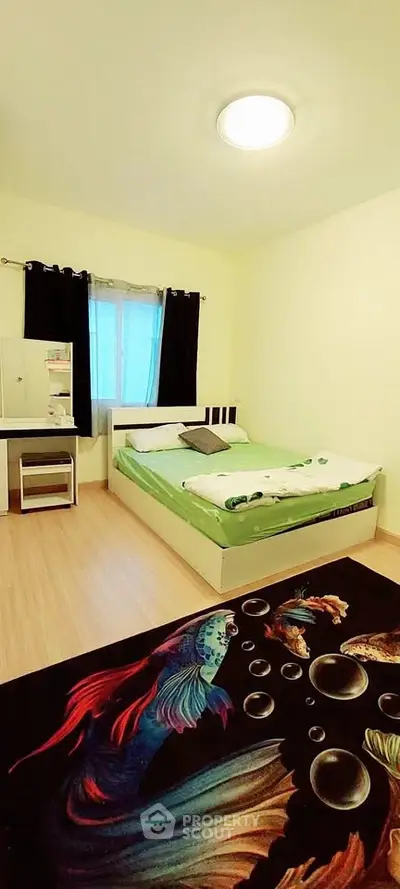 Cozy bedroom with vibrant fish-themed rug and modern furnishings