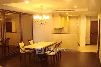 Elegant modern living room with chandelier and open layout design