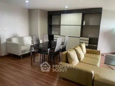Modern living room with stylish furniture and wooden flooring in a contemporary apartment.