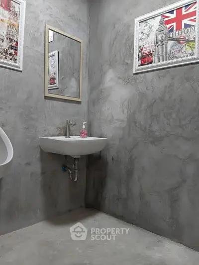 Modern minimalist bathroom with concrete walls and stylish decor
