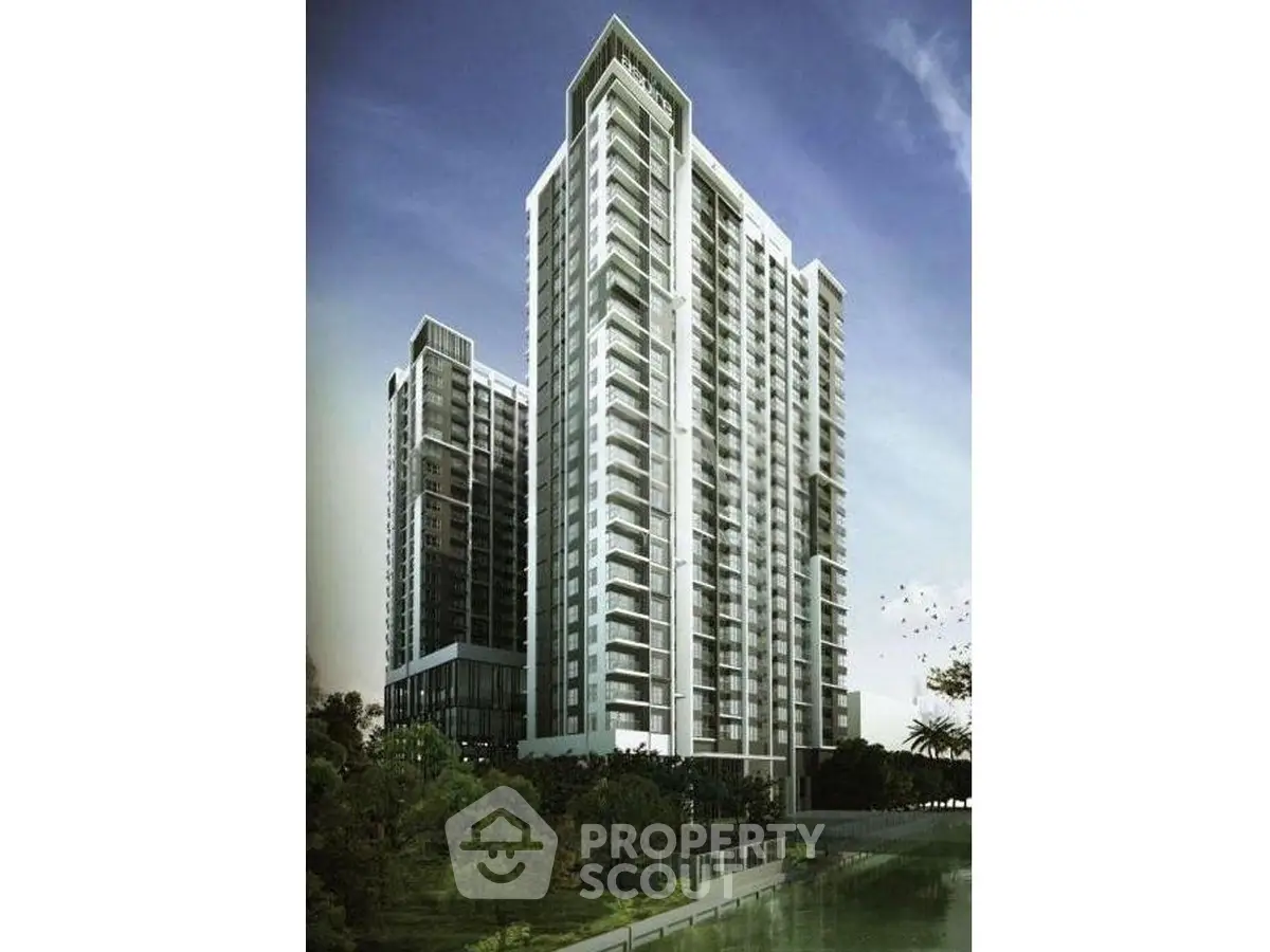 Stunning modern high-rise building with sleek architecture and lush surroundings.