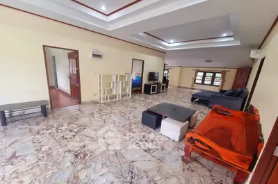 Spacious living room with marble flooring and modern furniture