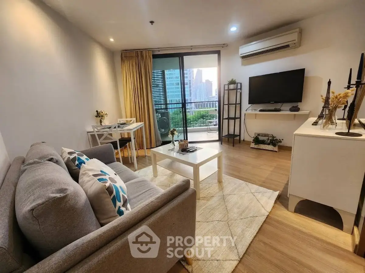 Modern living room with city view, stylish decor, and cozy ambiance.