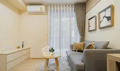 Modern living room with cozy sofa and stylish decor in a bright apartment.