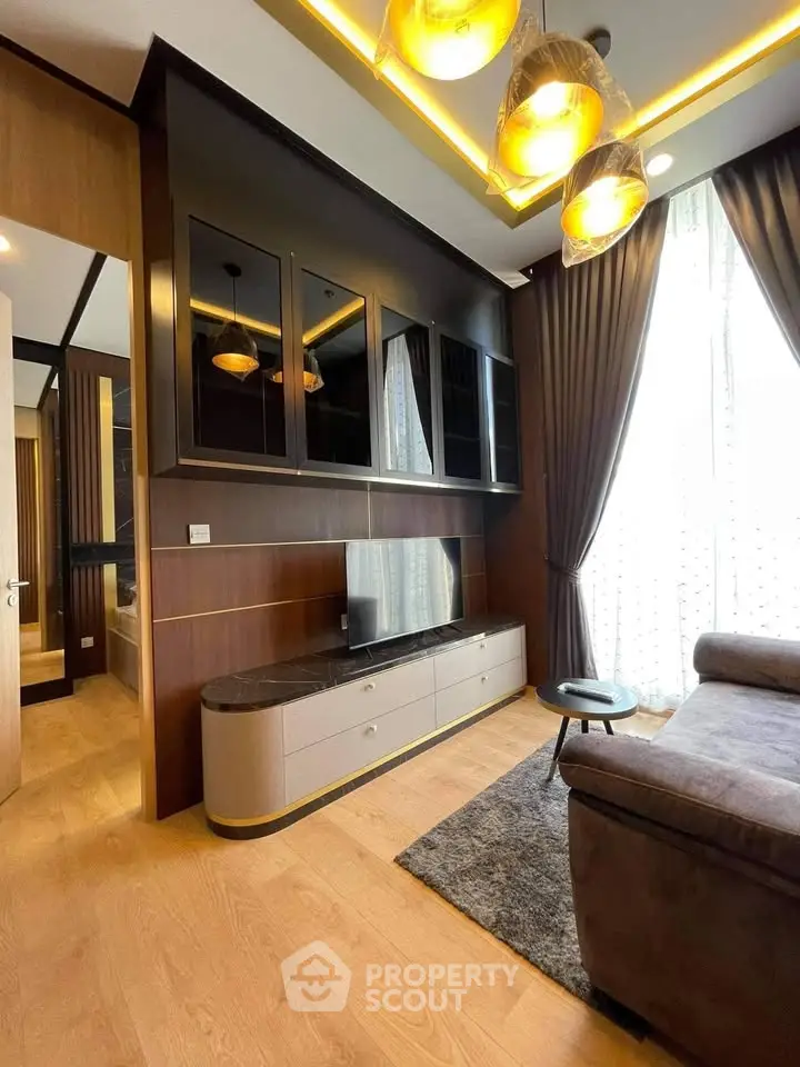 Luxurious living room with modern decor, large windows, and elegant lighting in a high-end apartment.