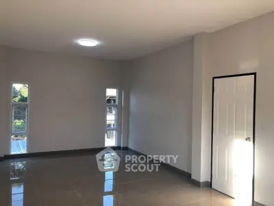 Spacious unfurnished room with natural light and modern design, perfect for customization.