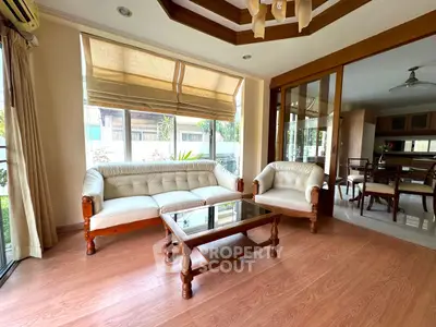 Elegant living room with wooden flooring and classic furniture