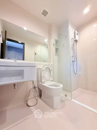 Modern bathroom with sleek fixtures and glass shower enclosure