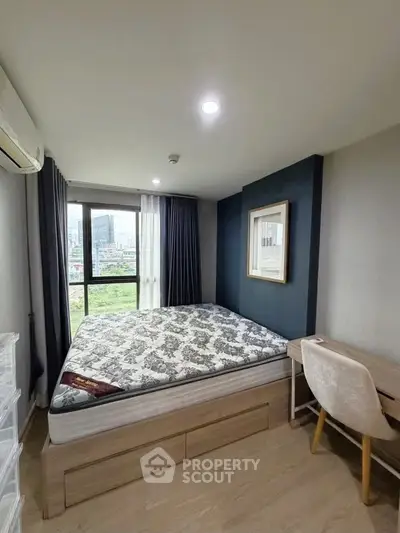 Modern bedroom with large window and stylish decor in urban apartment