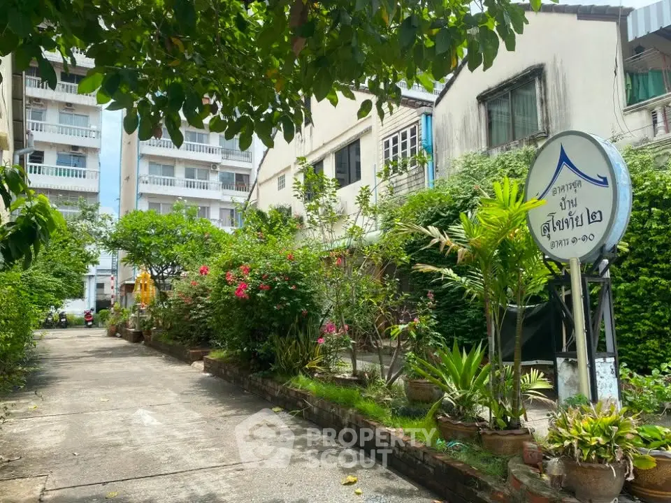 Charming residential building with lush garden and welcoming entrance