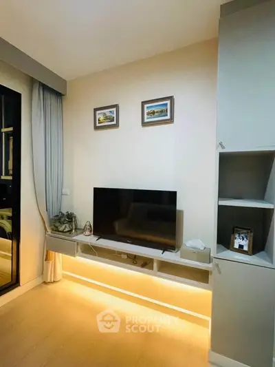Modern living room with sleek TV setup and ambient lighting