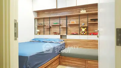 Modern bedroom with wooden accents and built-in shelves showcasing collectibles.