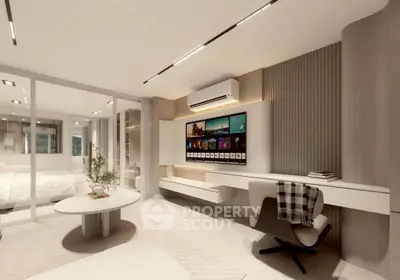 Modern living room with sleek design, featuring a wall-mounted TV, stylish furniture, and ambient lighting.