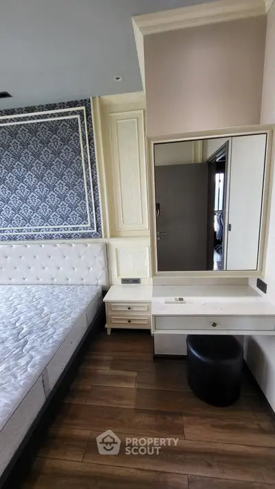 Elegant bedroom with stylish wallpaper and modern furniture