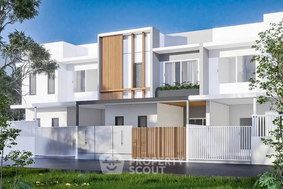 Modern white townhouse with sleek design and lush greenery